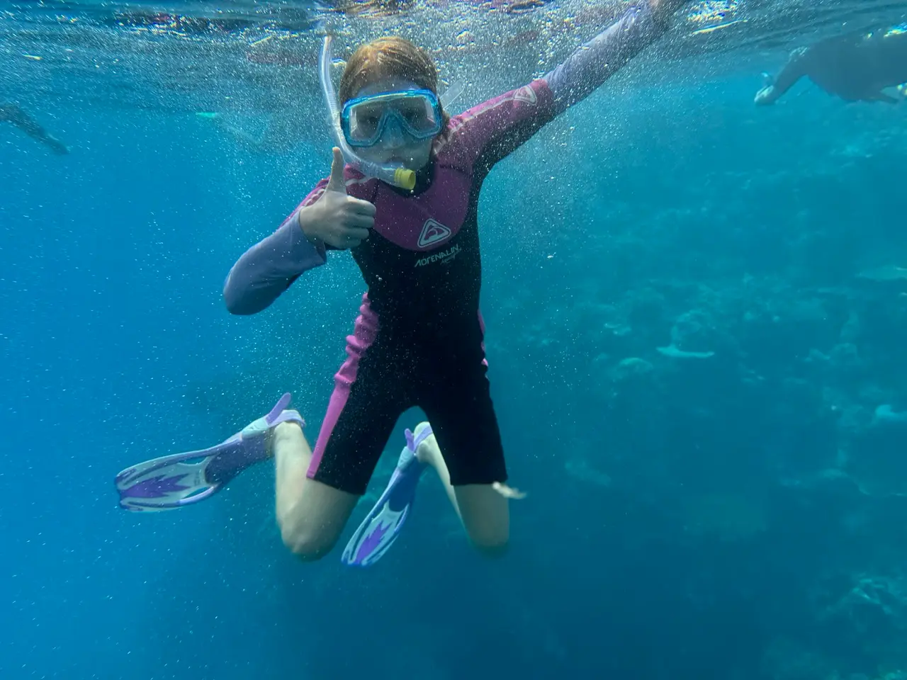 Kids in wetsuits at the Great Barrier Reef
