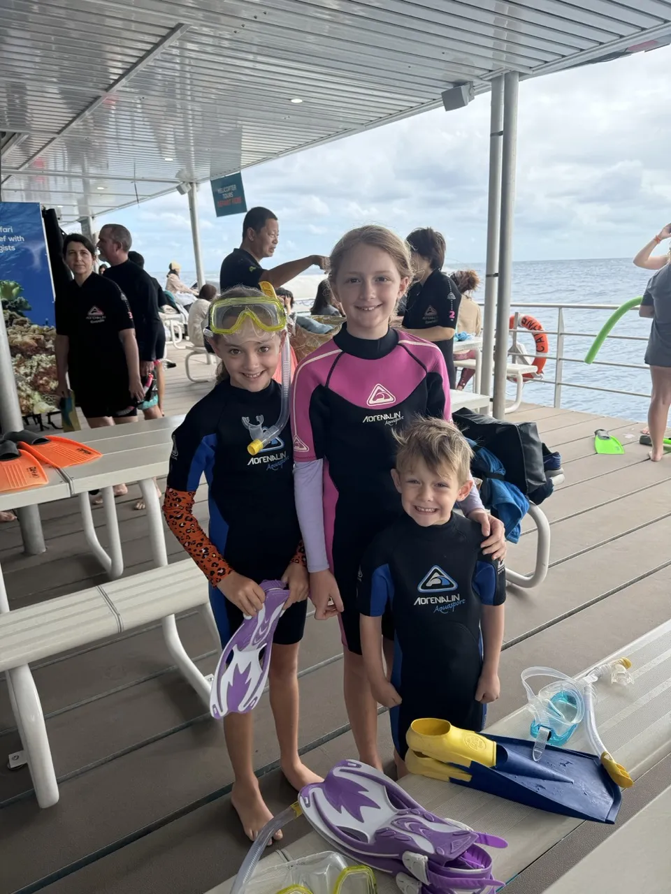 Kids in wetsuits at the Great Barrier Reef